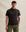 The Model is 187 cm and wears size M